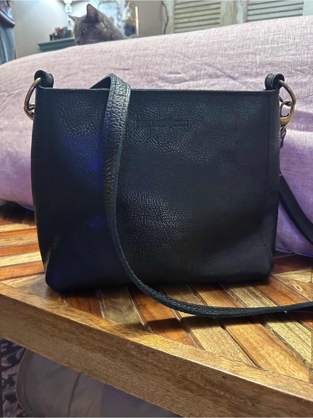 Portland Leather Black triangle Crossbody.